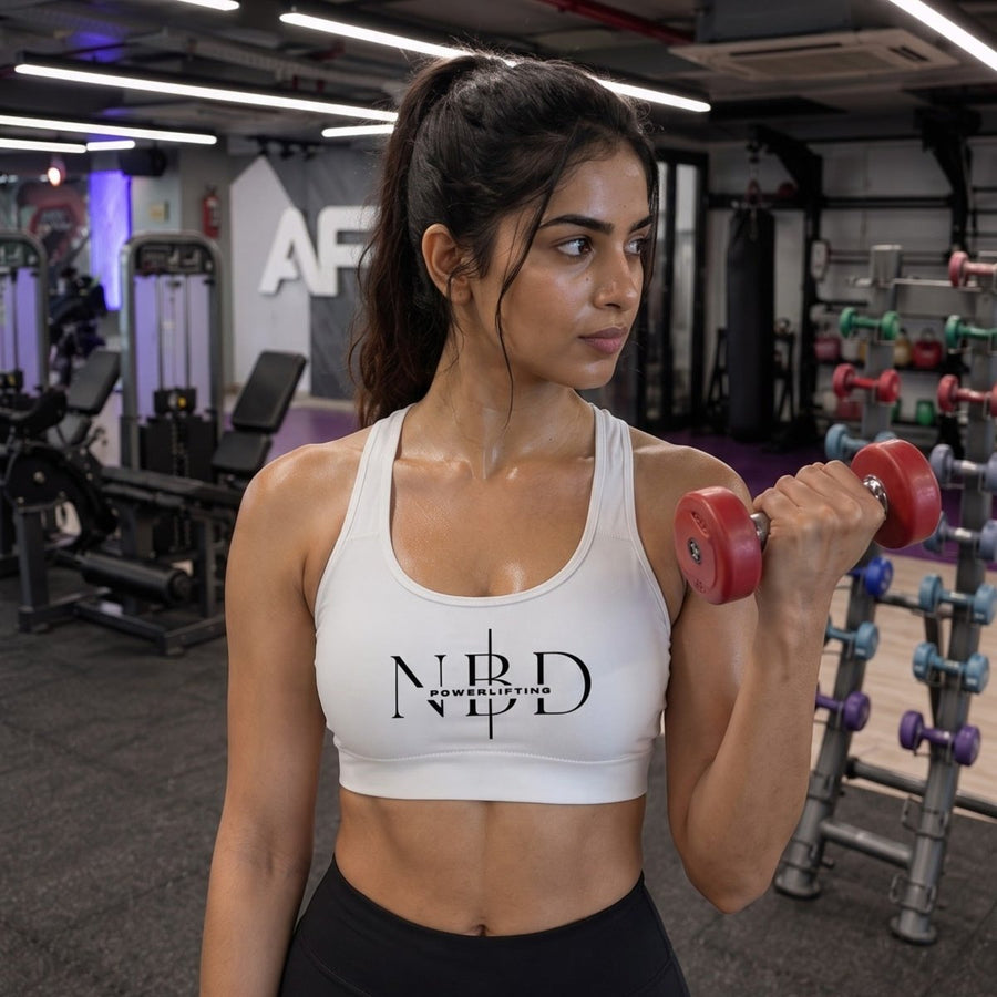 NBD high-performance sports bra worn during dumbbell training - workout apparel for women