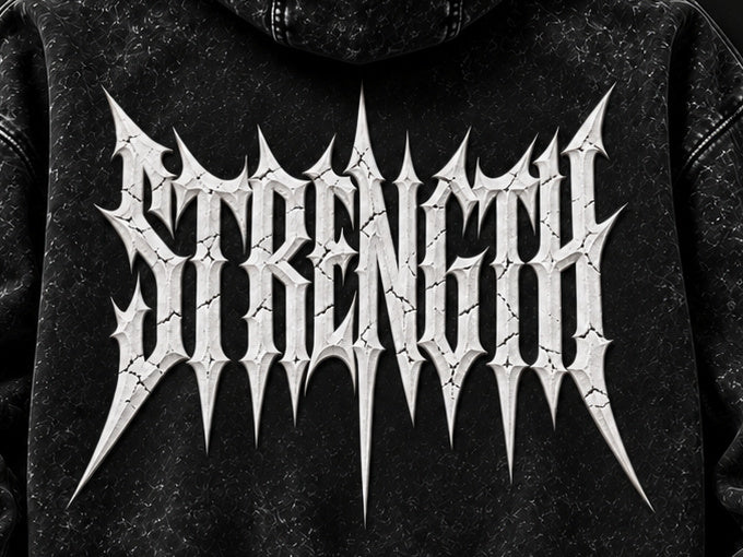 NBD STRENGTH acid wash hoodie in Black — back print close-up, white STRENGTH lettering