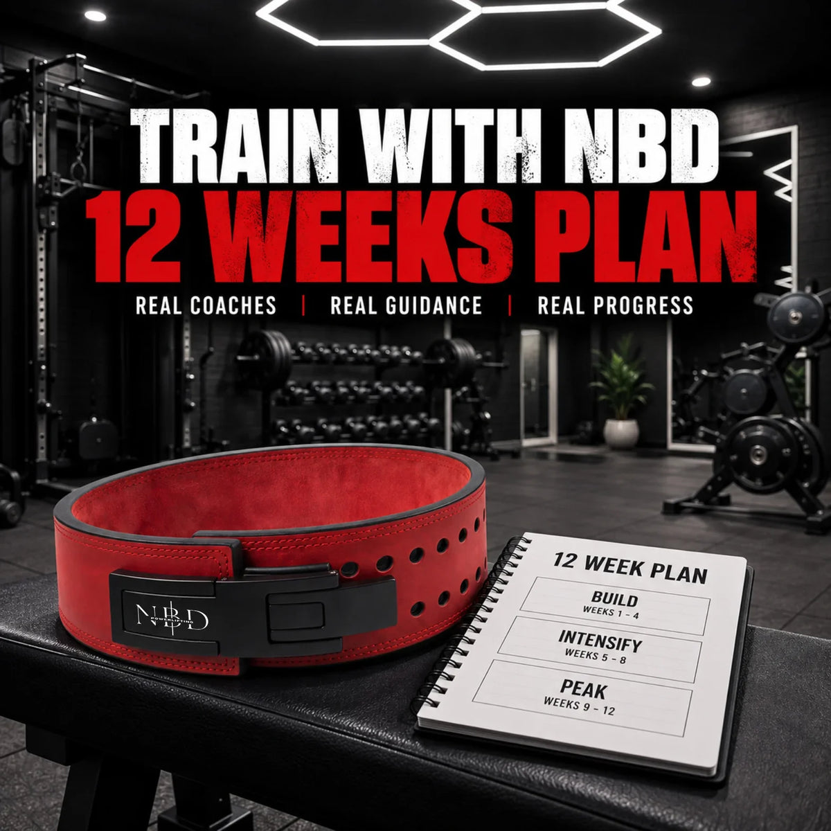 TRAIN WITH NBD online coaching — a red NBD lever belt on a gym bench beside a twelve-week training plan notebook.