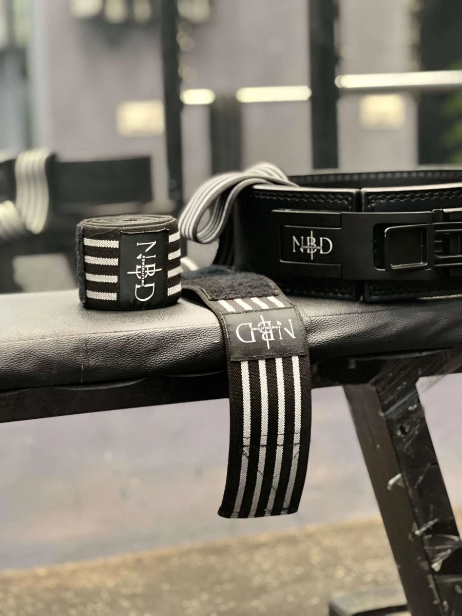 NBD heavy duty knee wraps powerlifting bandages back view during squat training professional support