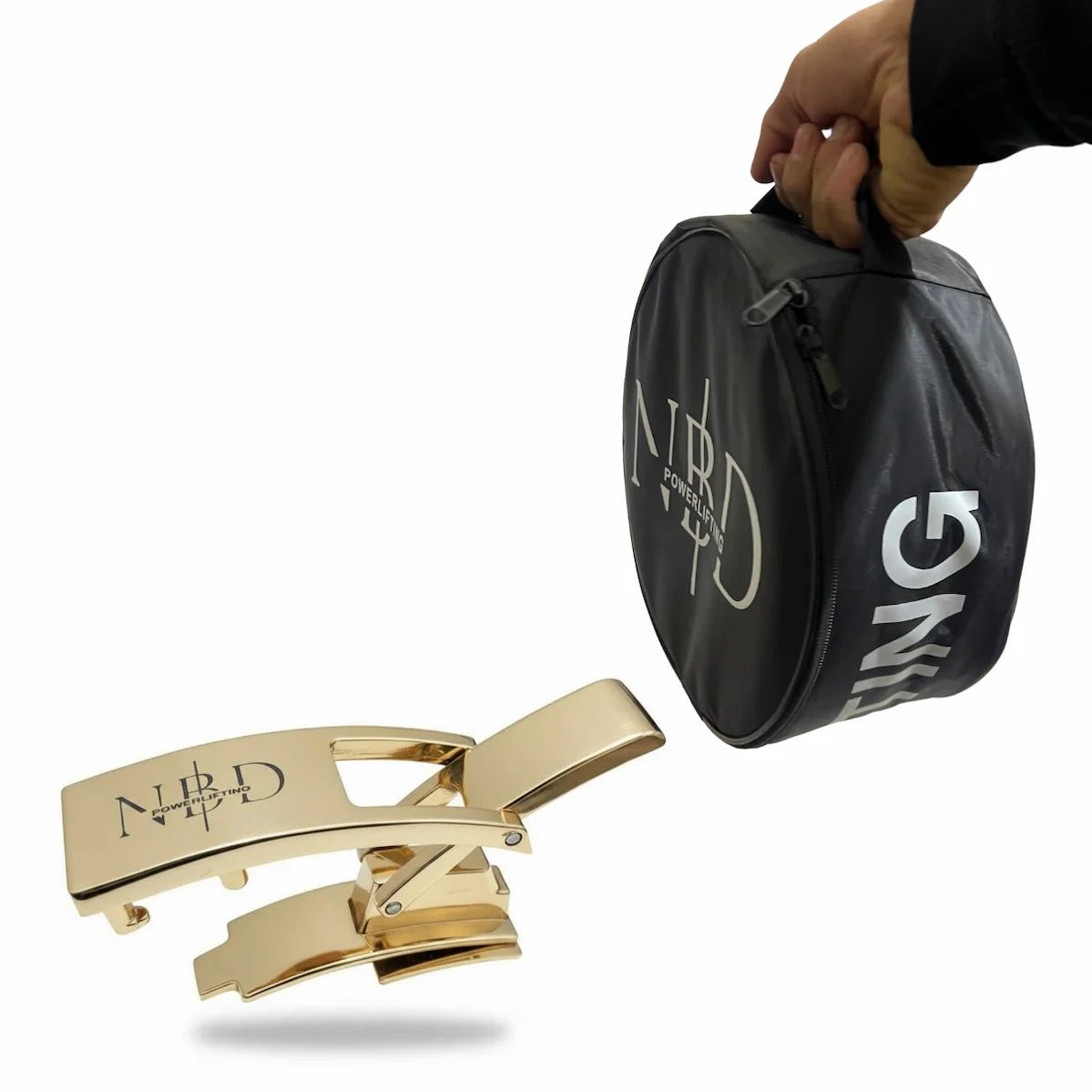 Gold belt buckle with 'NIRD' branding next to a black carrying case on a white background