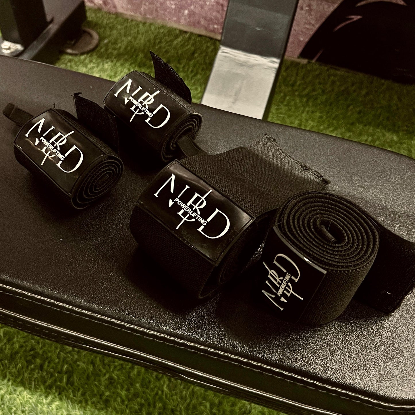 Extended 1-meter NBD Black Series Wrist Wraps, ideal for powerlifting, featuring robust construction for maximum support.

