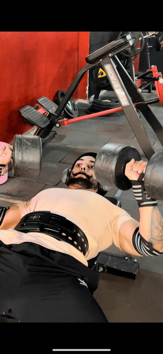 NBD elbow wraps powerlifting gear worn by athlete during heavy lifting training in India gym