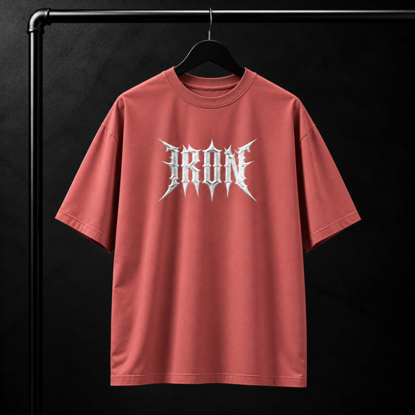 NBD IRON 240 GSM oversized T-shirt in Coral — front view, IRON raised in white 3D puff print across the chest, studio shot on a hanger
