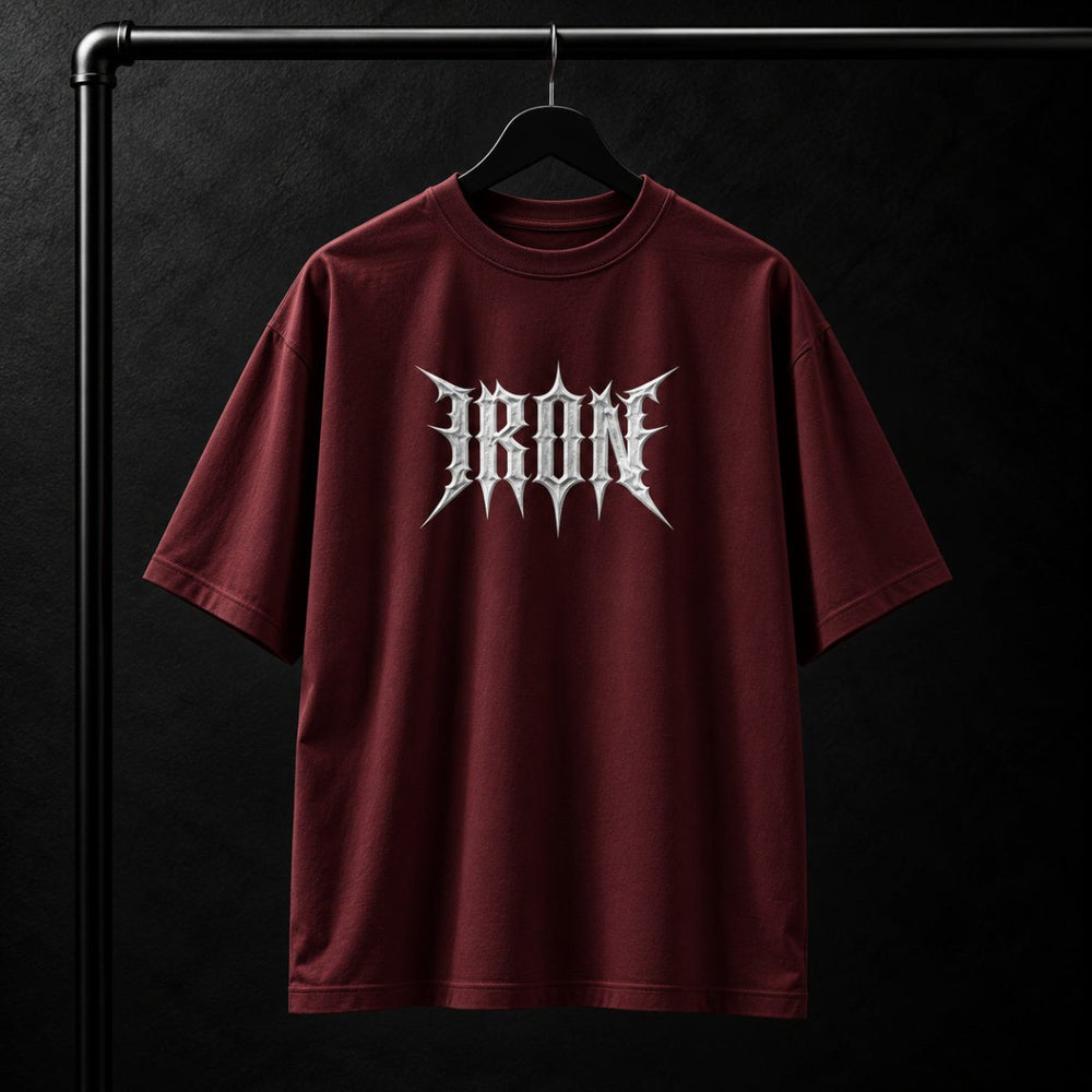 NBD IRON 240 GSM oversized T-shirt in Maroon — front view, IRON raised in white 3D puff print across the chest, studio shot on a hanger