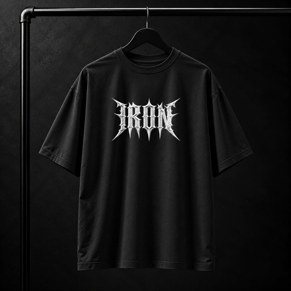 NBD IRON 240 GSM oversized T-shirt in Black — front view, IRON raised in white 3D puff print across the chest, studio shot on a hanger