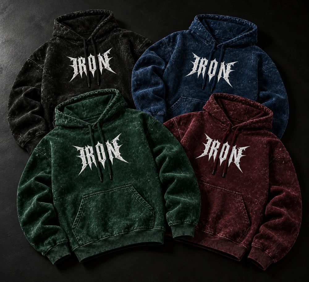 NBD IRON acid wash hoodie in all four colours — overlapping flat lay with the IRON print on each