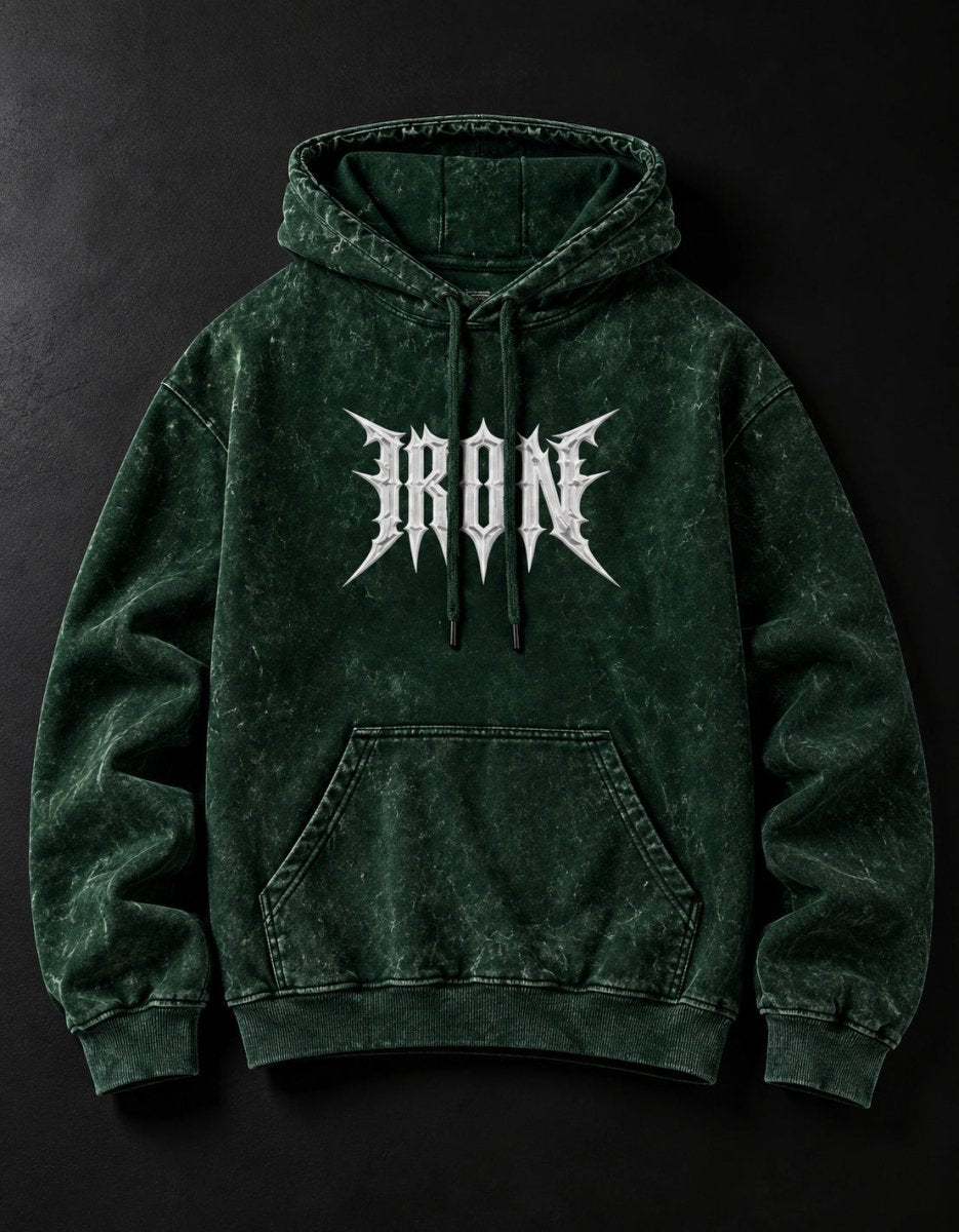 NBD IRON acid wash hoodie in Bottle Green — front view, white IRON lettering across the chest, drawcord hood and kangaroo pocket