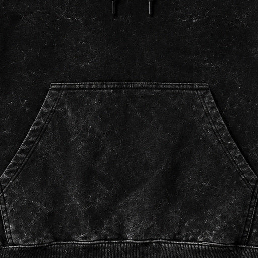NBD IRON acid wash hoodie in Black — front close-up, kangaroo pocket and drawcords