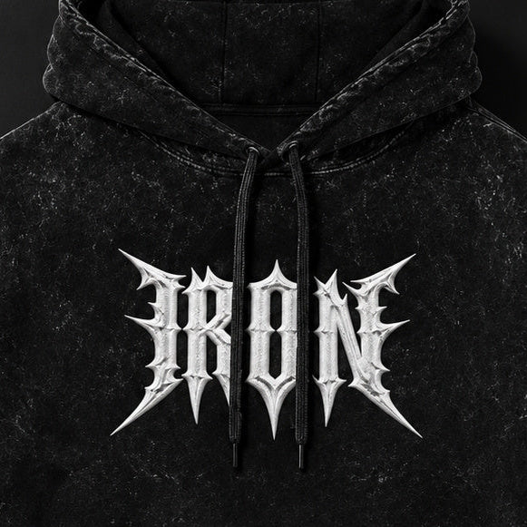 NBD IRON acid wash hoodie in Black — front print close-up, white IRON lettering across the chest