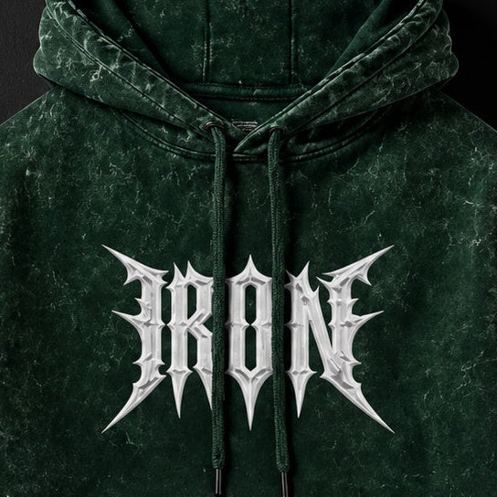 NBD IRON acid wash hoodie in Bottle Green — front print close-up, white IRON lettering across the chest