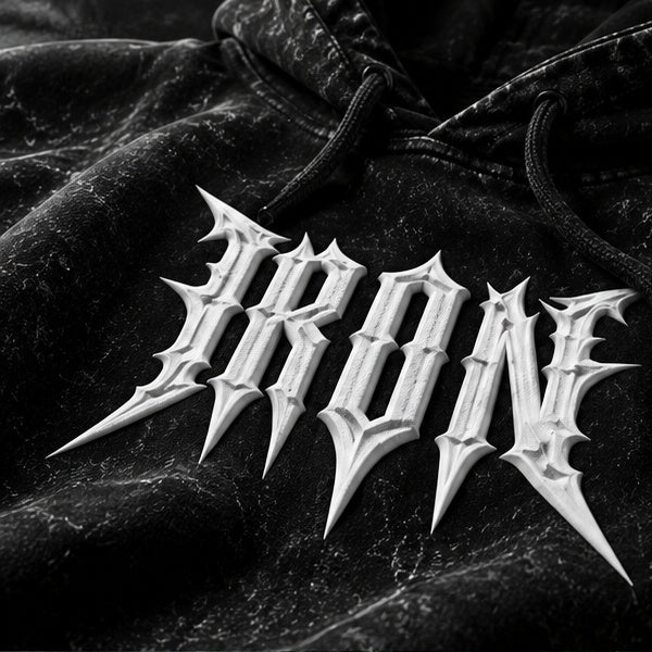 NBD IRON acid wash hoodie — close-up of the white IRON lettering across the chest of the black hoodie