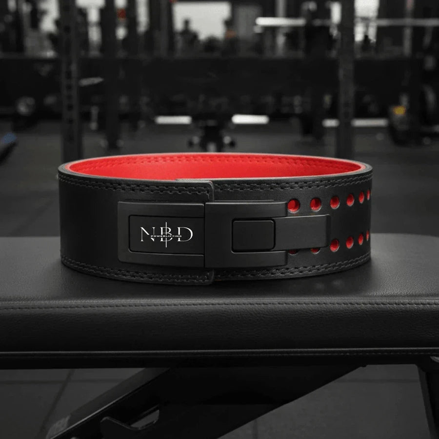 NBD Close up view of NBD lifting belt and knee wraps powerlifting accessories detail shot