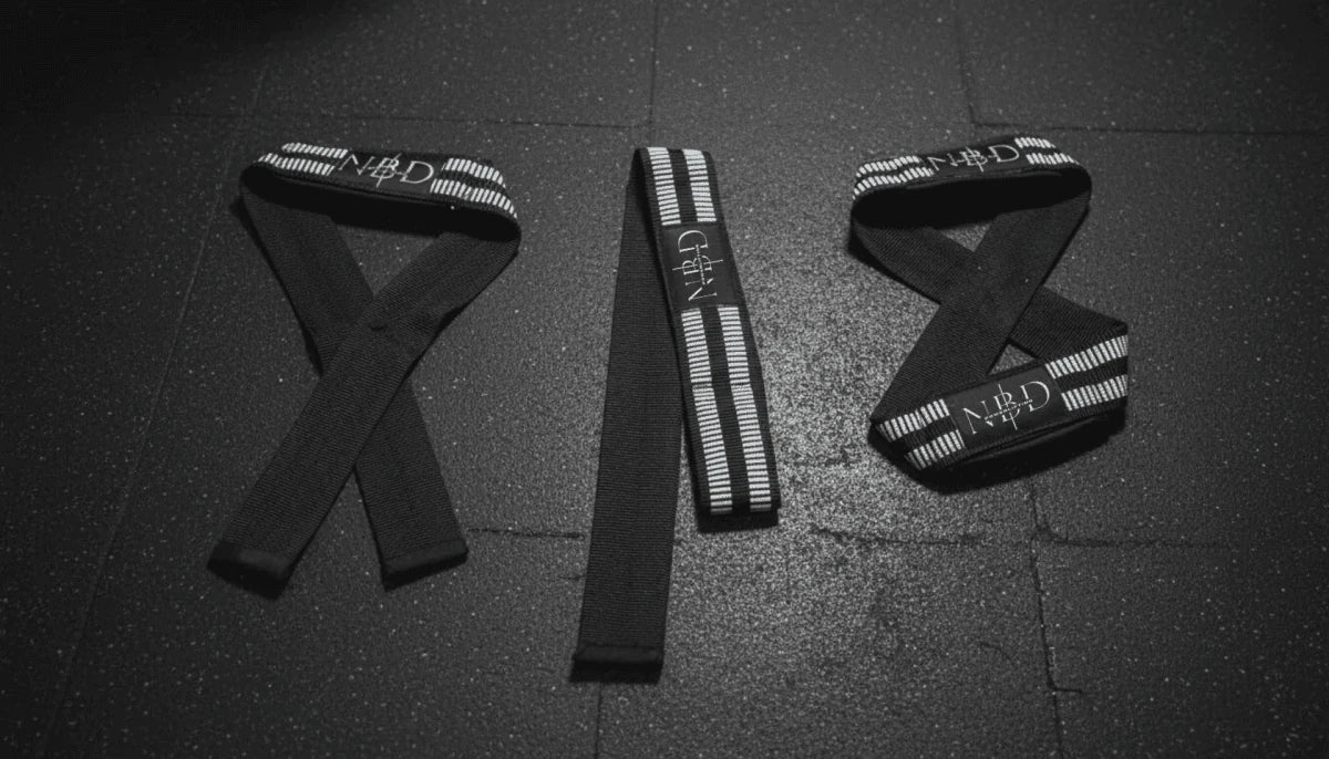 NBD white rubber lifting straps side view showing premium grip coating for powerlifting maximum support