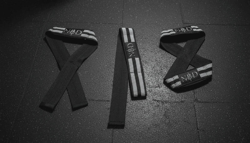 NBD Close up white rubber coating NBD lifting straps premium grip material powerlifting