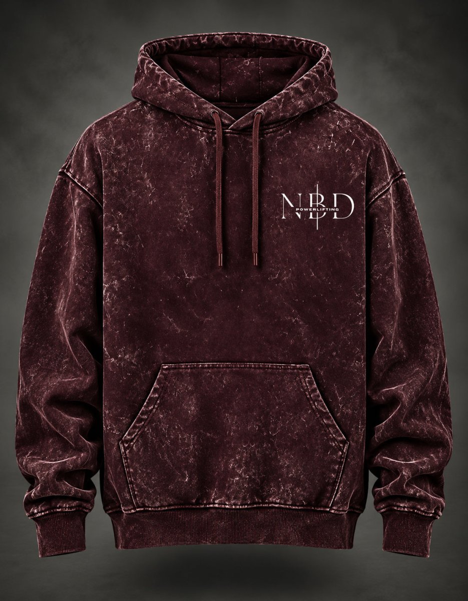 NBD POWER acid wash hoodie in Maroon — front view, NBD Powerlifting chest mark, kangaroo pocket and drawcord hood, studio shot