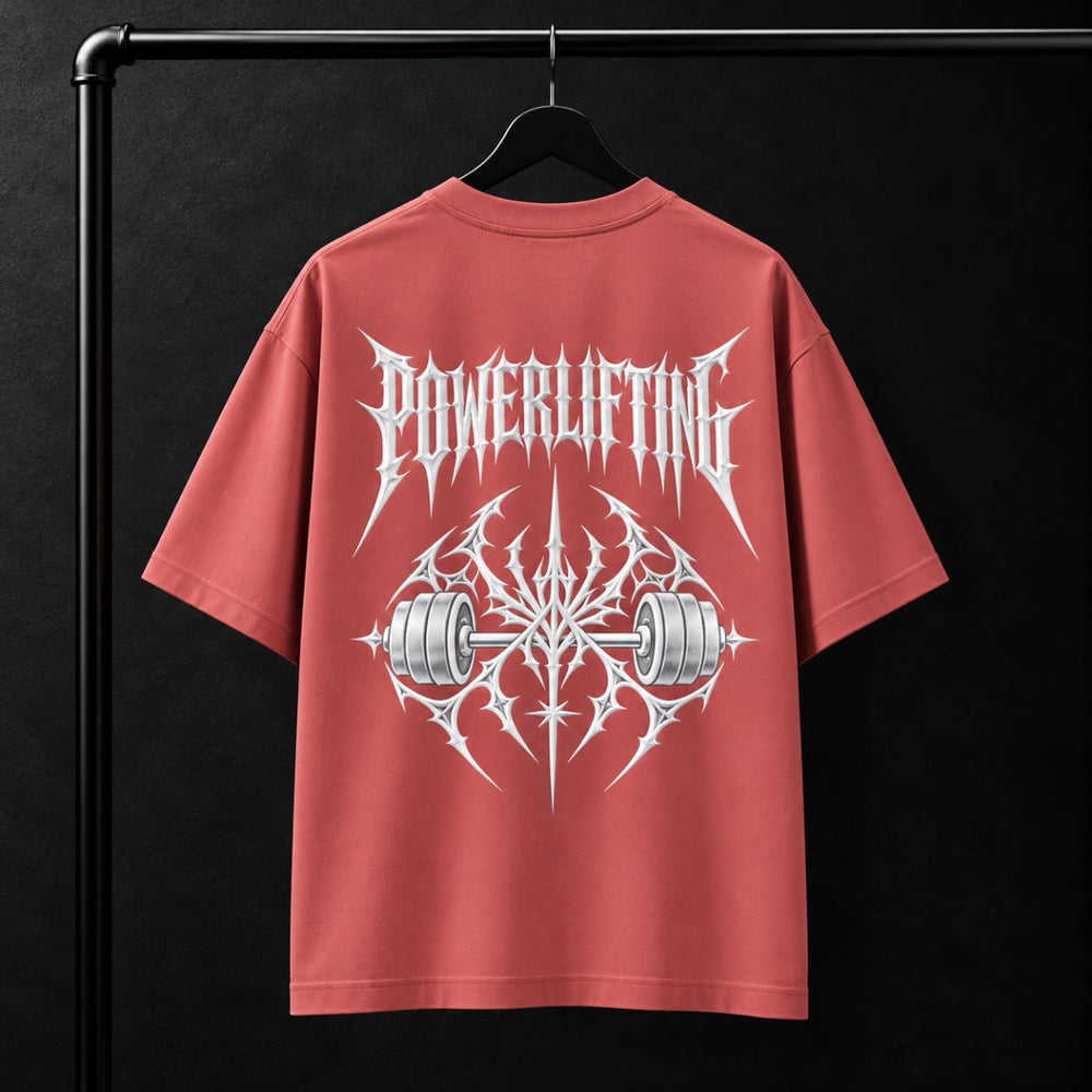 NBD POWERLIFTING Crest oversized T-shirt in Coral — back view, raised white 3D puff print POWERLIFTING lettering above a barbell crest, studio shot on a hanger
