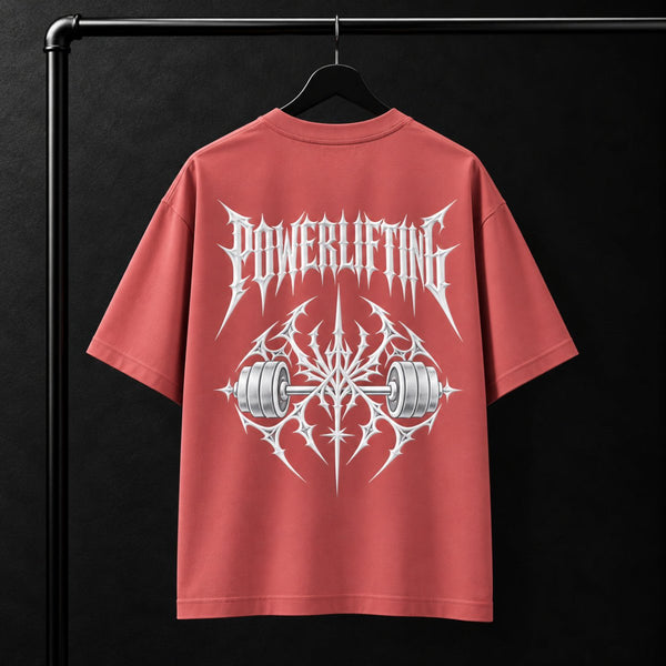 NBD POWERLIFTING Crest oversized T-shirt in Coral — back view, raised white 3D puff print POWERLIFTING lettering above a barbell crest, studio shot on a hanger