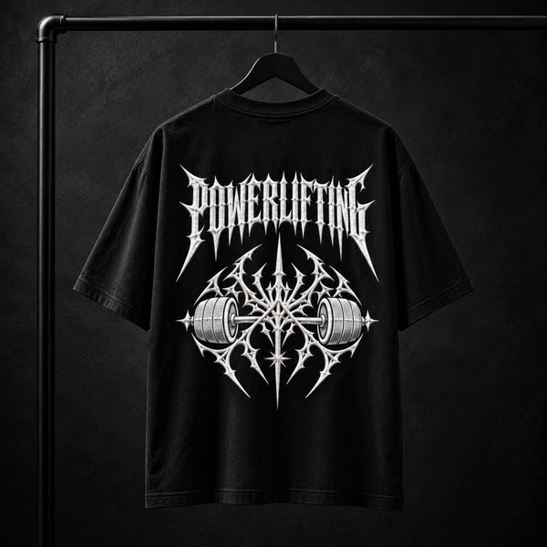 NBD POWERLIFTING Crest oversized T-shirt in Black — back view, raised white 3D puff print POWERLIFTING lettering above a barbell crest, studio shot on a hanger