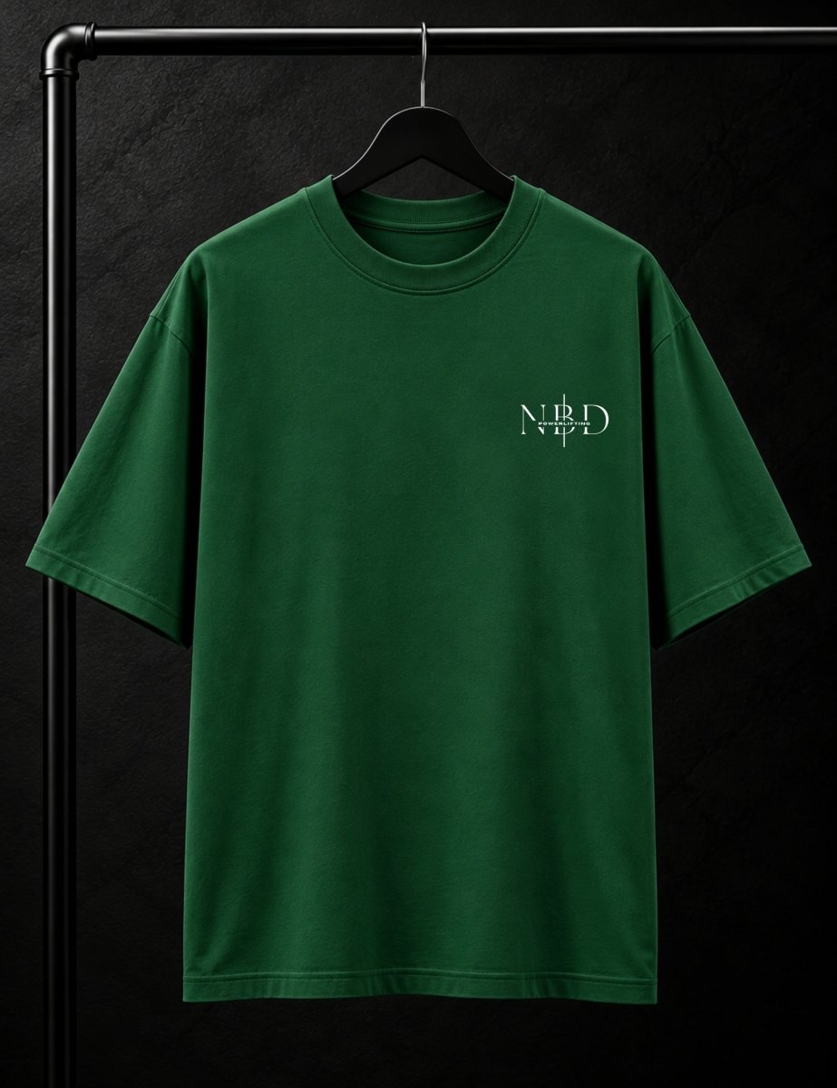NBD POWERLIFTING Crest oversized T-shirt in Bottle Green — front view, ribbed crew neck and small NBD Powerlifting mark on the left chest, studio shot on a hanger