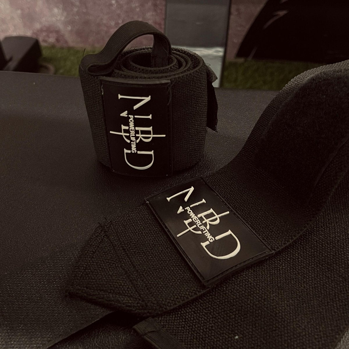 Close-up of NBD Black Series Wrist Wraps in Small size (18 inches), showcasing premium leather design and adjustable Velcro closure.

