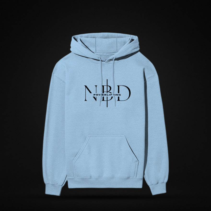 NBD SIGNATURE 300 GSM logo hoodie in Baby Blue — front view, NBD Powerlifting monogram on the chest, kangaroo pocket, studio shot