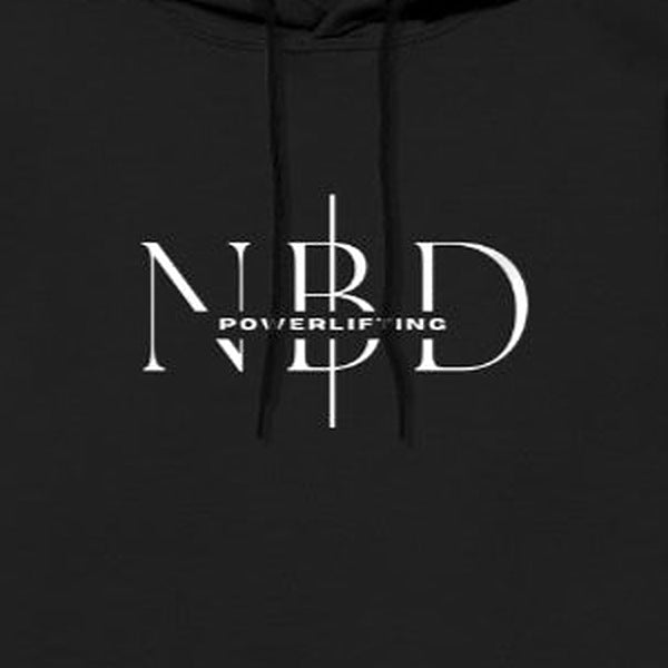 NBD SIGNATURE logo hoodie in Black — chest close-up of the NBD Powerlifting monogram print