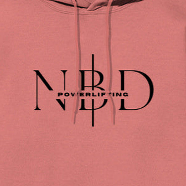 NBD SIGNATURE logo hoodie in Coral — chest close-up of the NBD Powerlifting monogram print