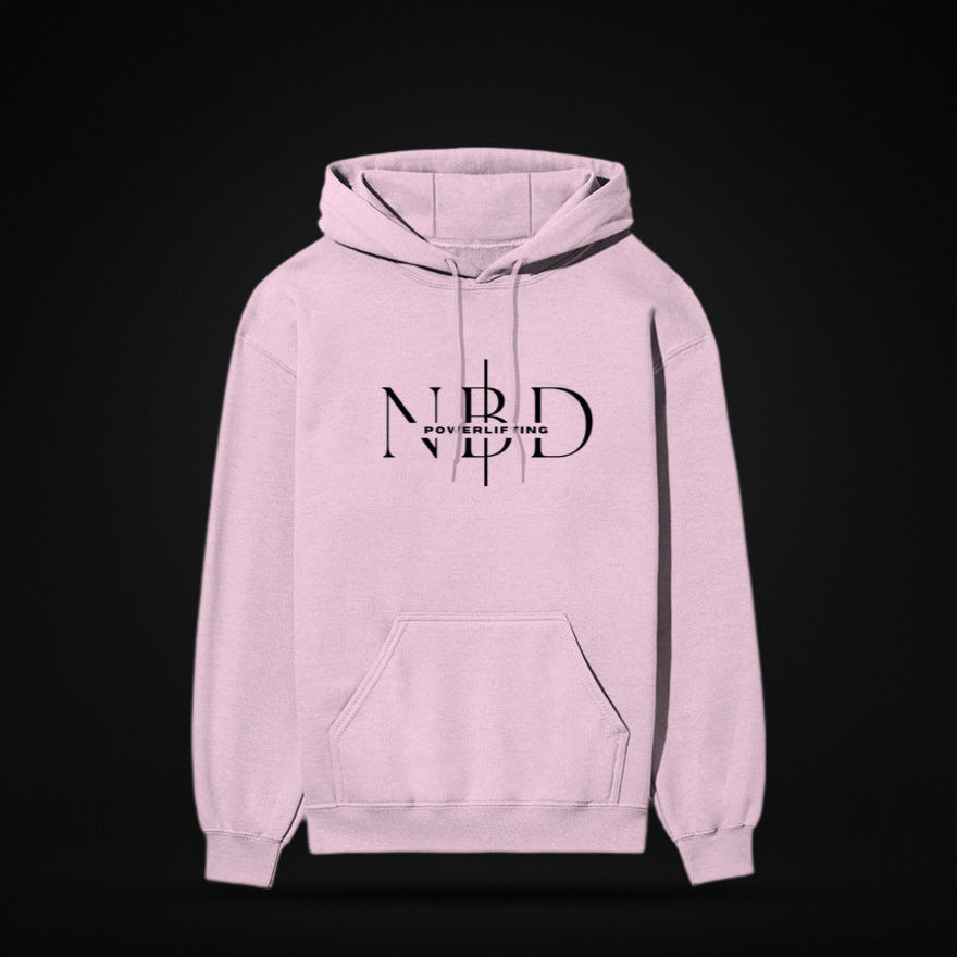 NBD SIGNATURE 300 GSM logo hoodie in Light Baby Pink — front view, NBD Powerlifting monogram on the chest, kangaroo pocket, studio shot