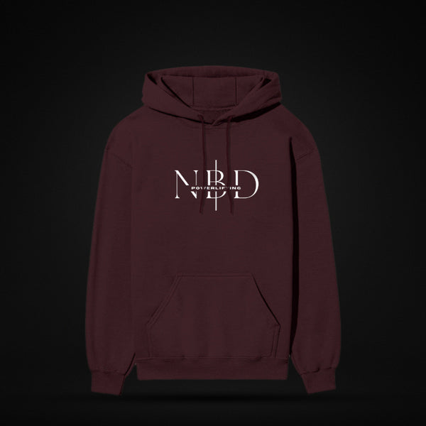 NBD SIGNATURE 300 GSM logo hoodie in Maroon — front view, NBD Powerlifting monogram on the chest, kangaroo pocket, studio shot