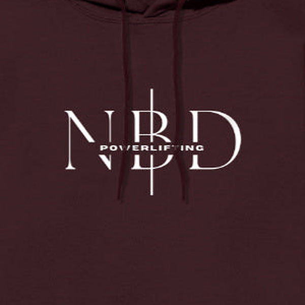 NBD SIGNATURE logo hoodie in Maroon — chest close-up of the NBD Powerlifting monogram print