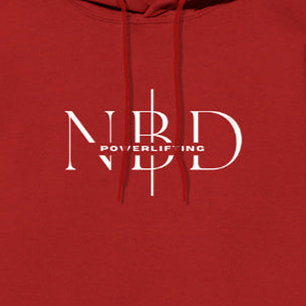 NBD SIGNATURE logo hoodie in Red — chest close-up of the NBD Powerlifting monogram print