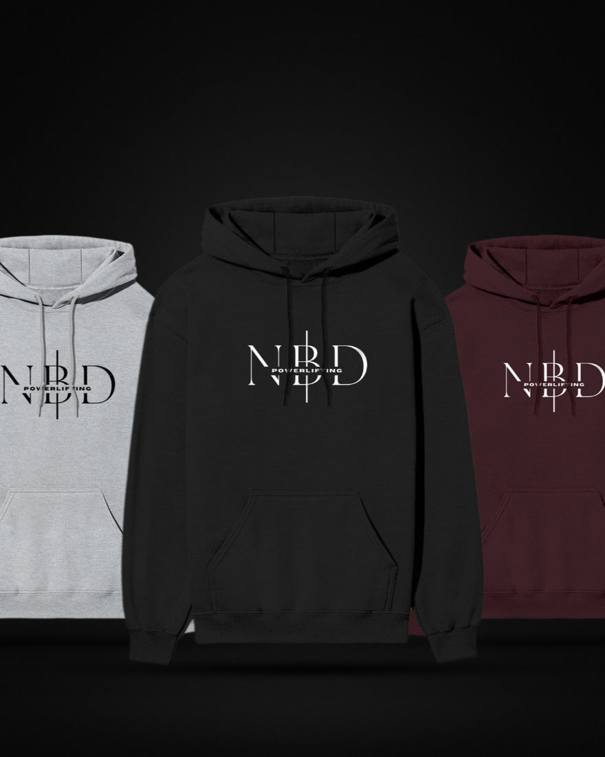 Three NBD SIGNATURE 300 GSM logo hoodies standing together on a dark studio sheet