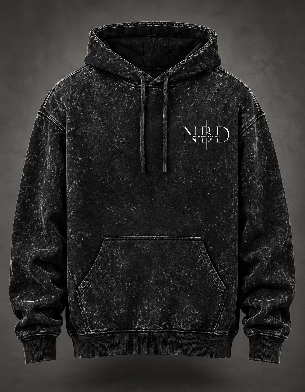 NBD STRENGTH acid wash hoodie in Black — front view, NBD Powerlifting chest mark, kangaroo pocket and drawcord hood, studio shot