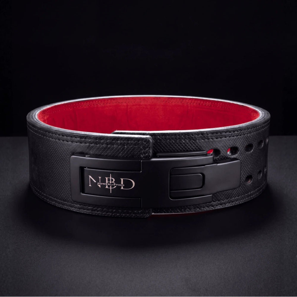 The NBD Viper belt, lever open, on a dark surface