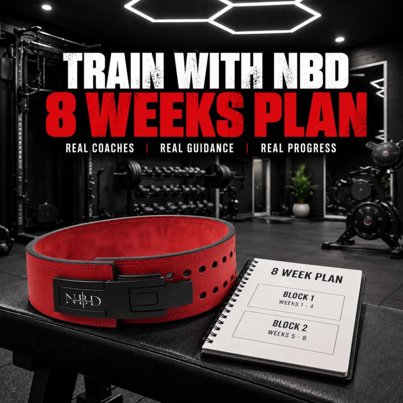 TRAIN WITH NBD 8 Week Online Coaching — a red NBD lever belt on a gym bench beside an eight-week training plan notebook showing two four-week blocks.